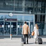 Business couple walking to the airport