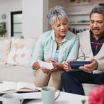 elderly couple managing money wisely