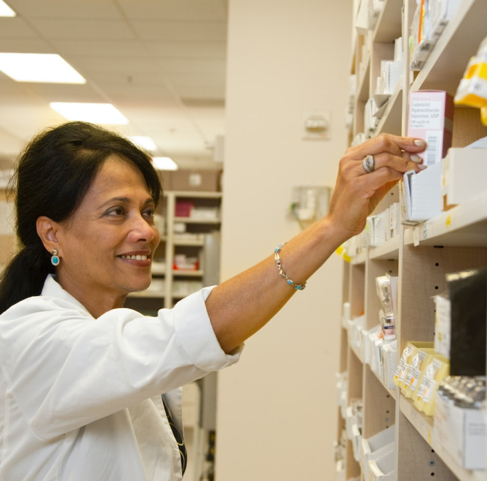 Pharmacist getting a prescription for the shelf