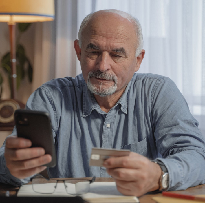 Older man looking at phone