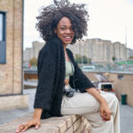 happy young woman on a urban background