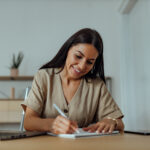 woman writing a list