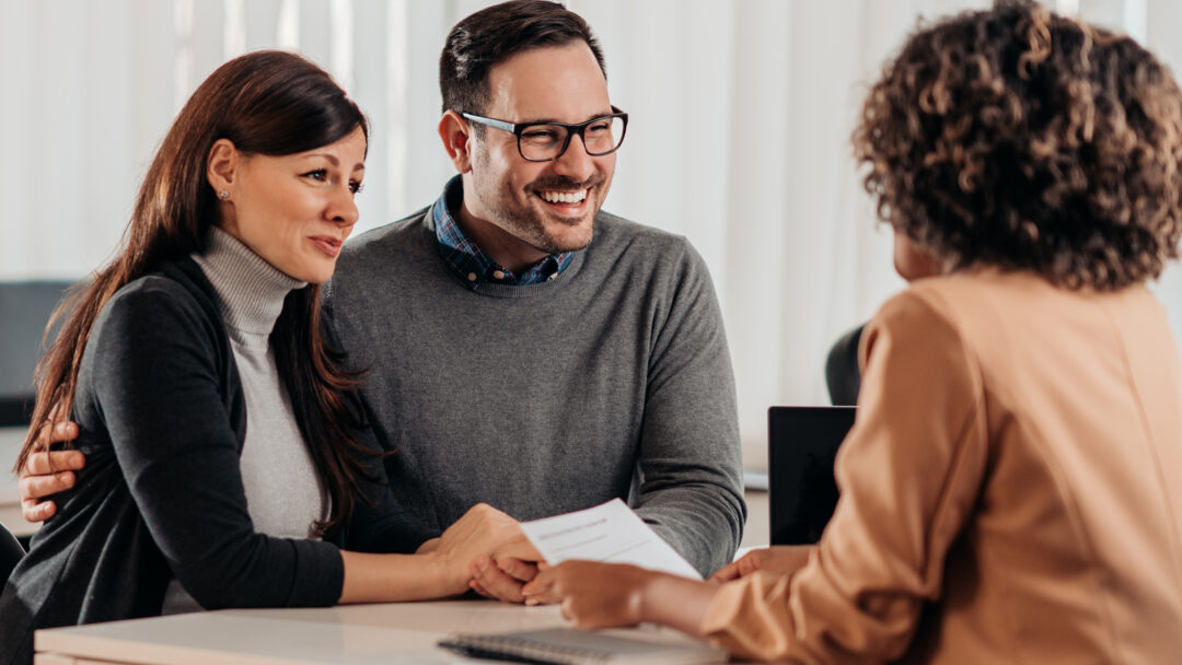 husband and wife meeting with banker