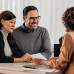 husband and wife meeting with banker