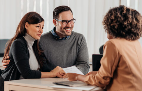 husband and wife meeting with banker