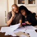 man and woman surrounded by bills