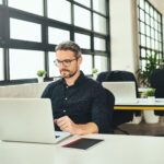 Man at an office desk working on computer