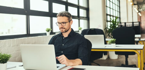 Man at an office desk working on computer