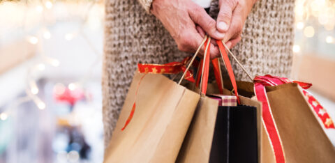 person holding shopping bags