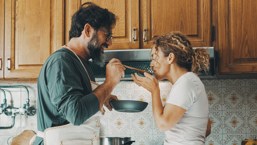 couple cooking in kitchen