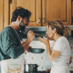 couple cooking in kitchen