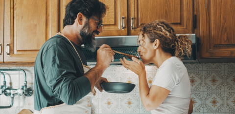 couple cooking in kitchen