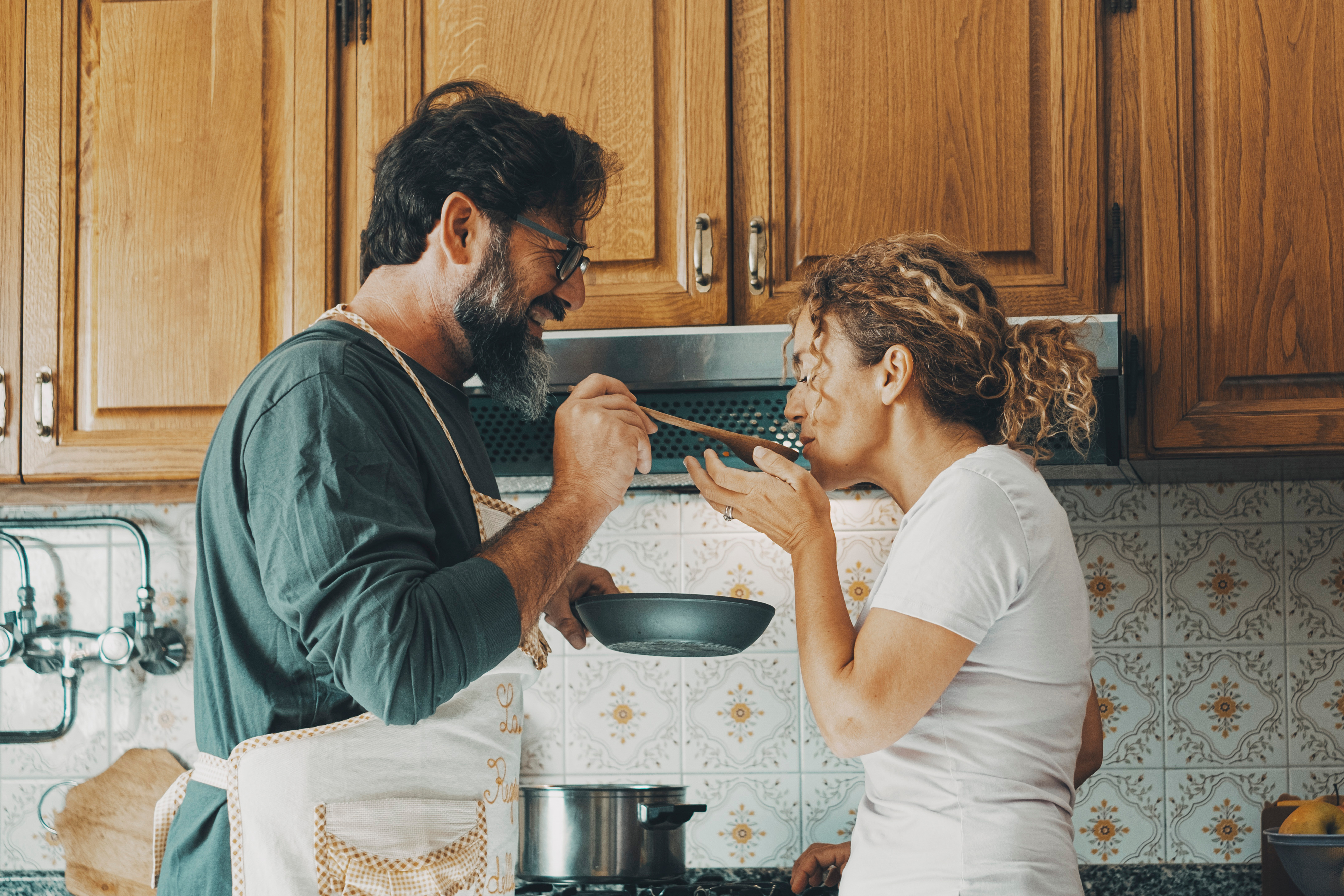 couple cooking in kitchen